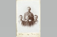 Three unidentified young men with Norm, circa 1905-1911
